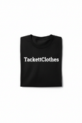 Black t-shirt with TackettClothes brand print on white background